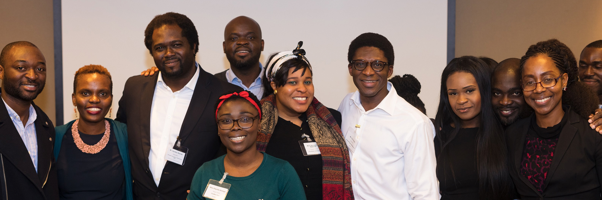Community members smiling together at a historic Connect4Better gathering