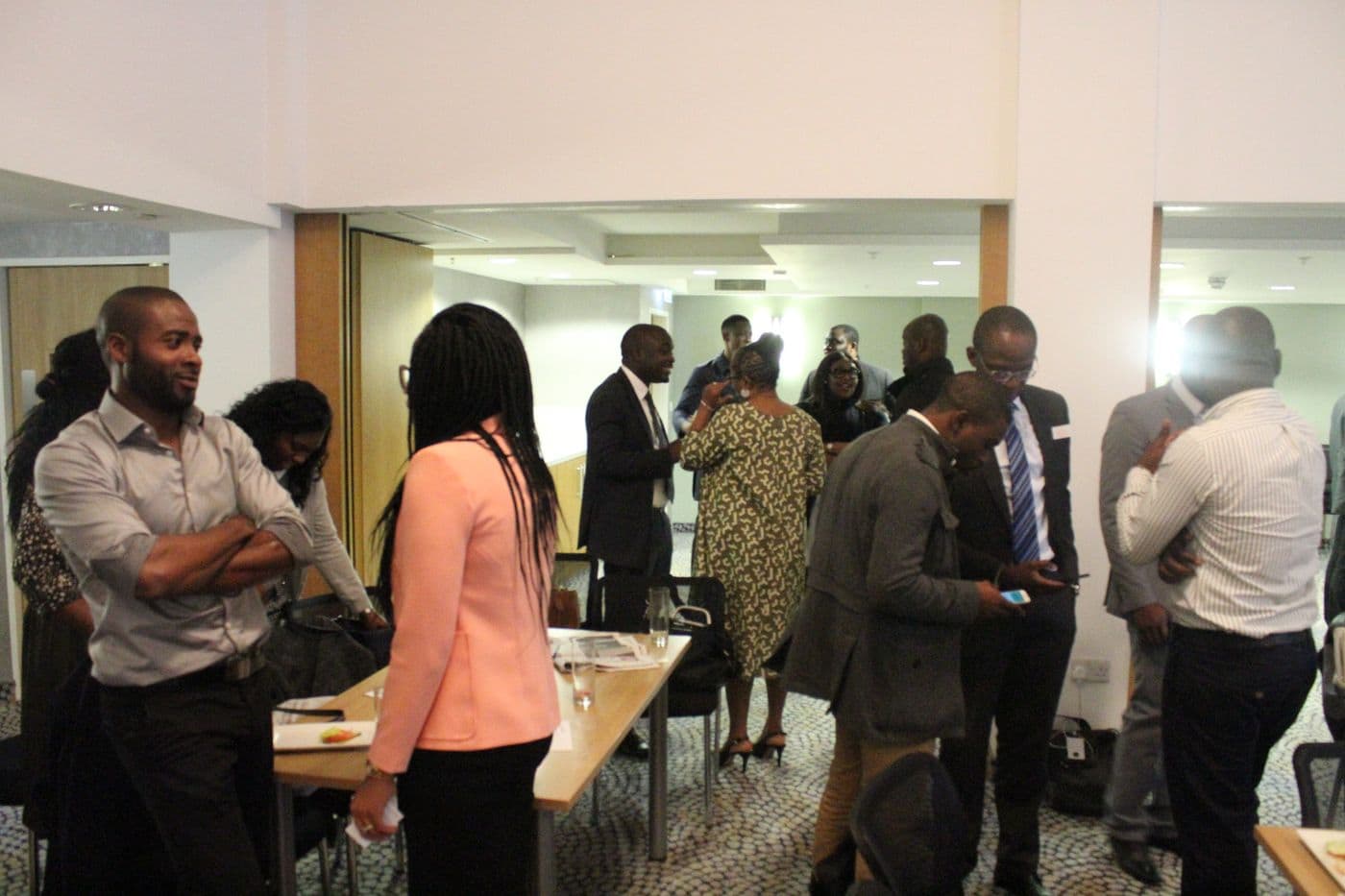 Attendees talking around the tables