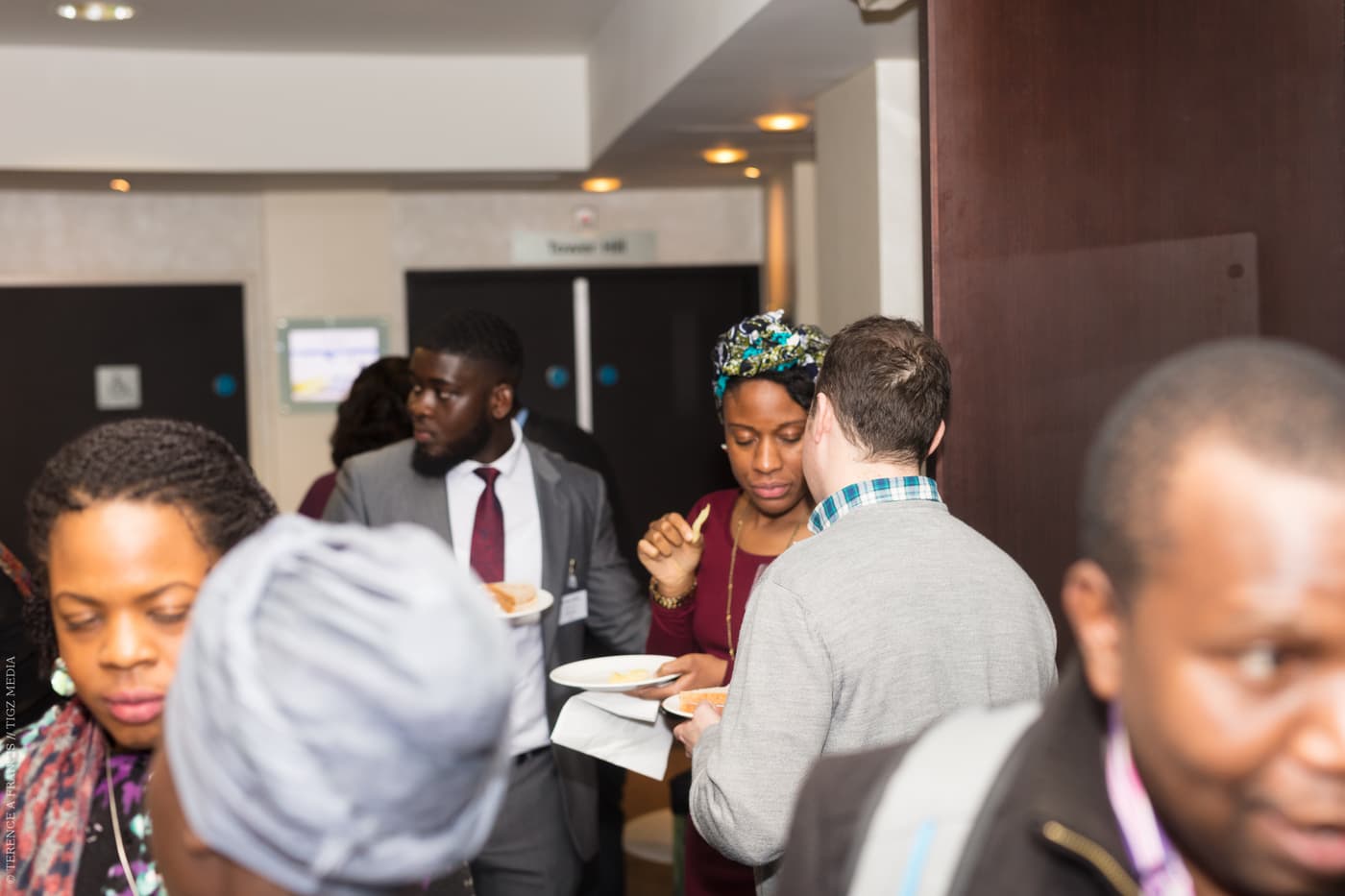 Attendees mingling before the session