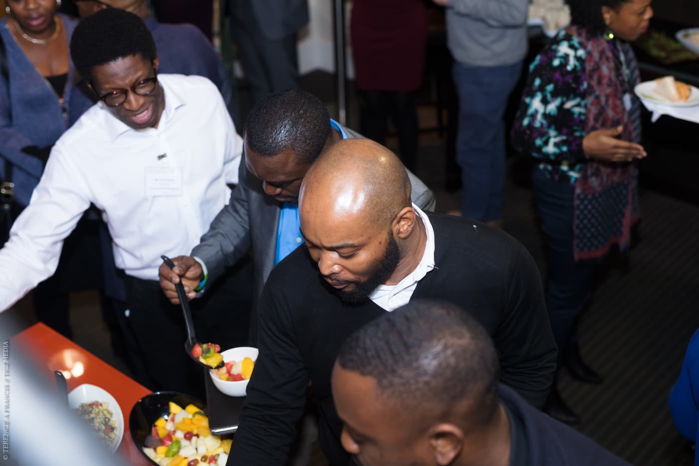 Attendees serving themselves at the buffet