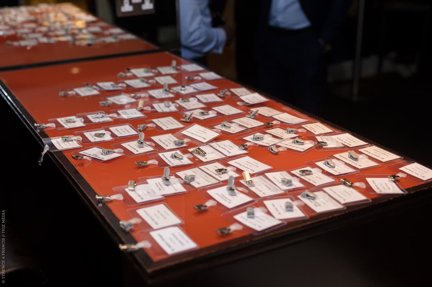 Name badges laid out on the welcome desk