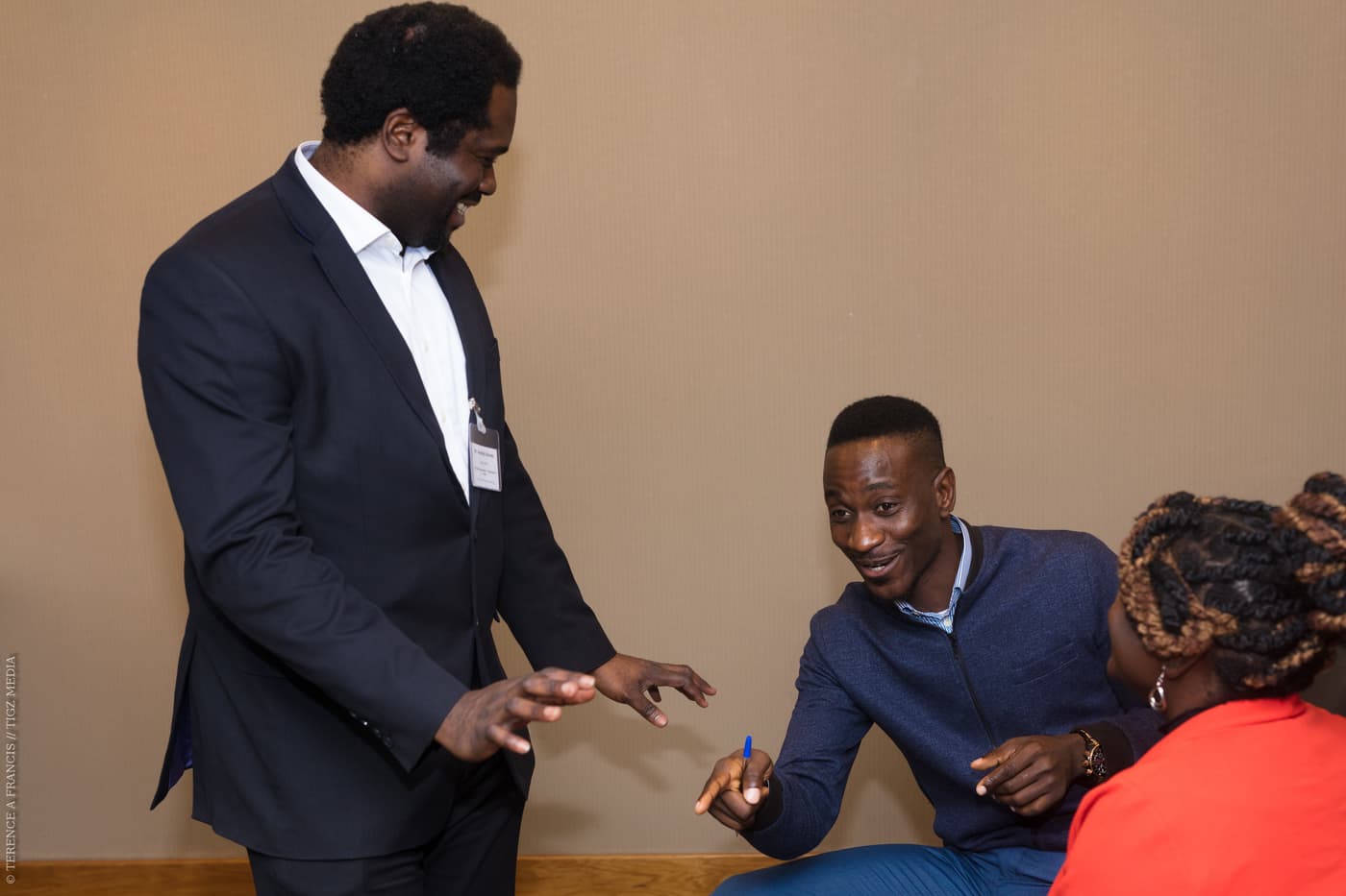 Two attendees greeting each other