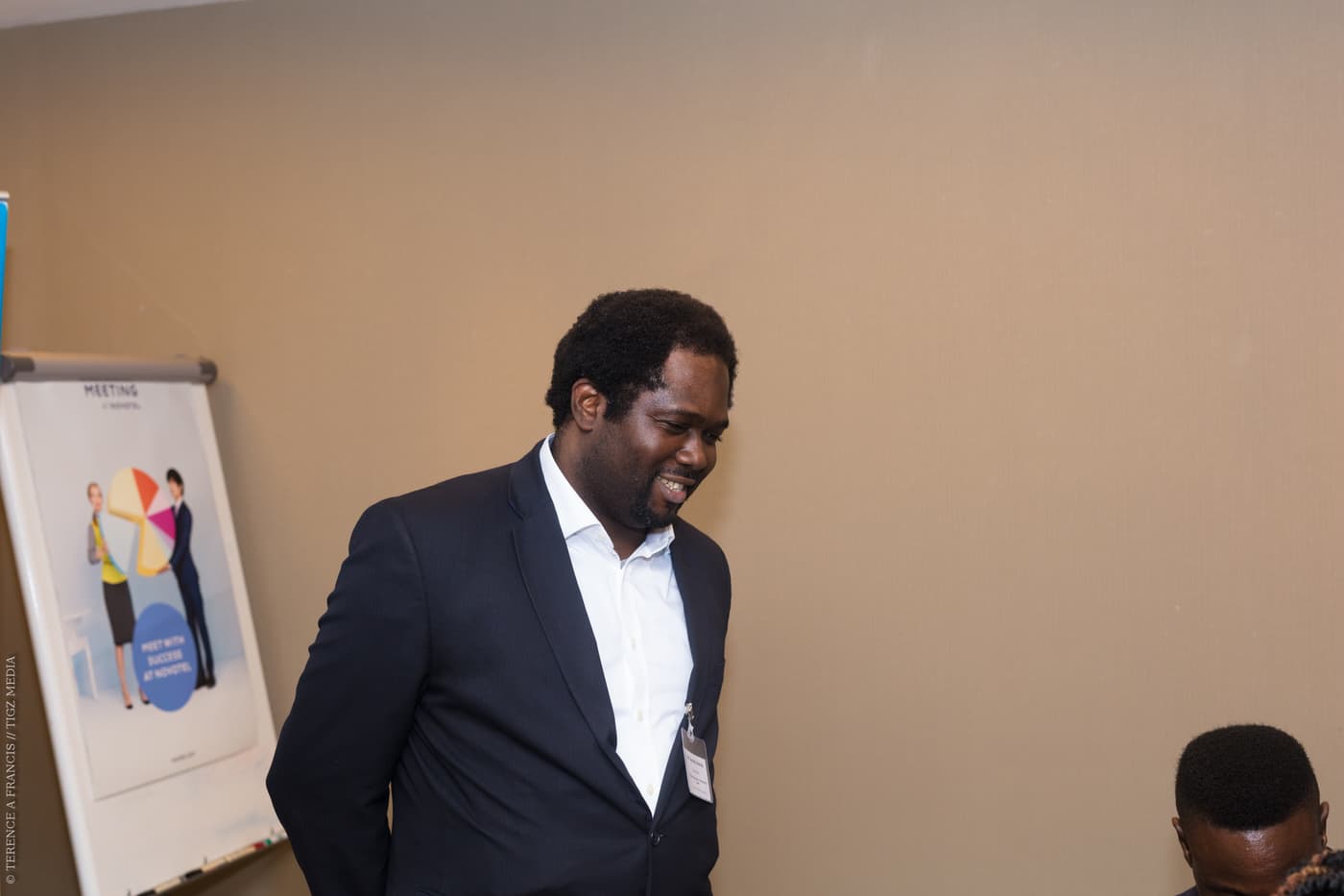 An attendee laughing during the reception