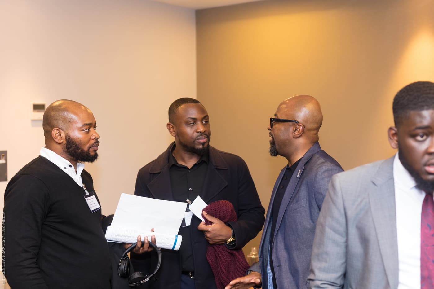 Three attendees in conversation