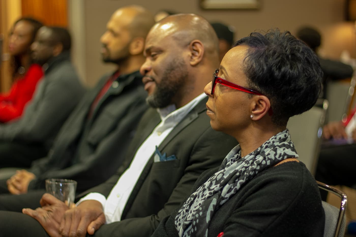 Attendees listening from the audience