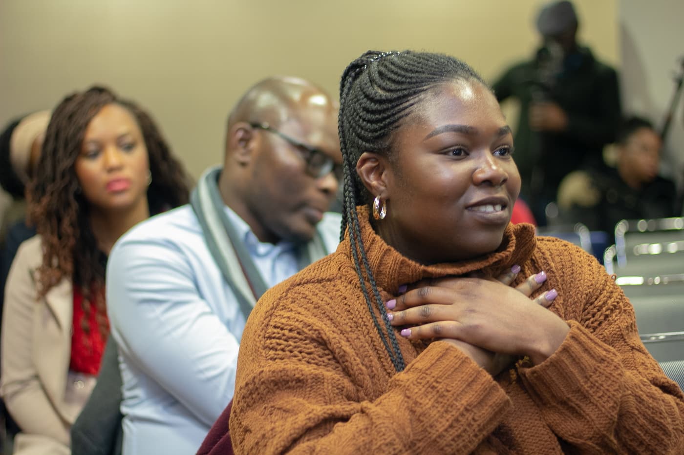 An attendee listening from the audience