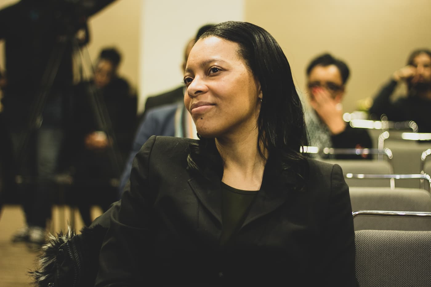 An attendee listening during a pitch