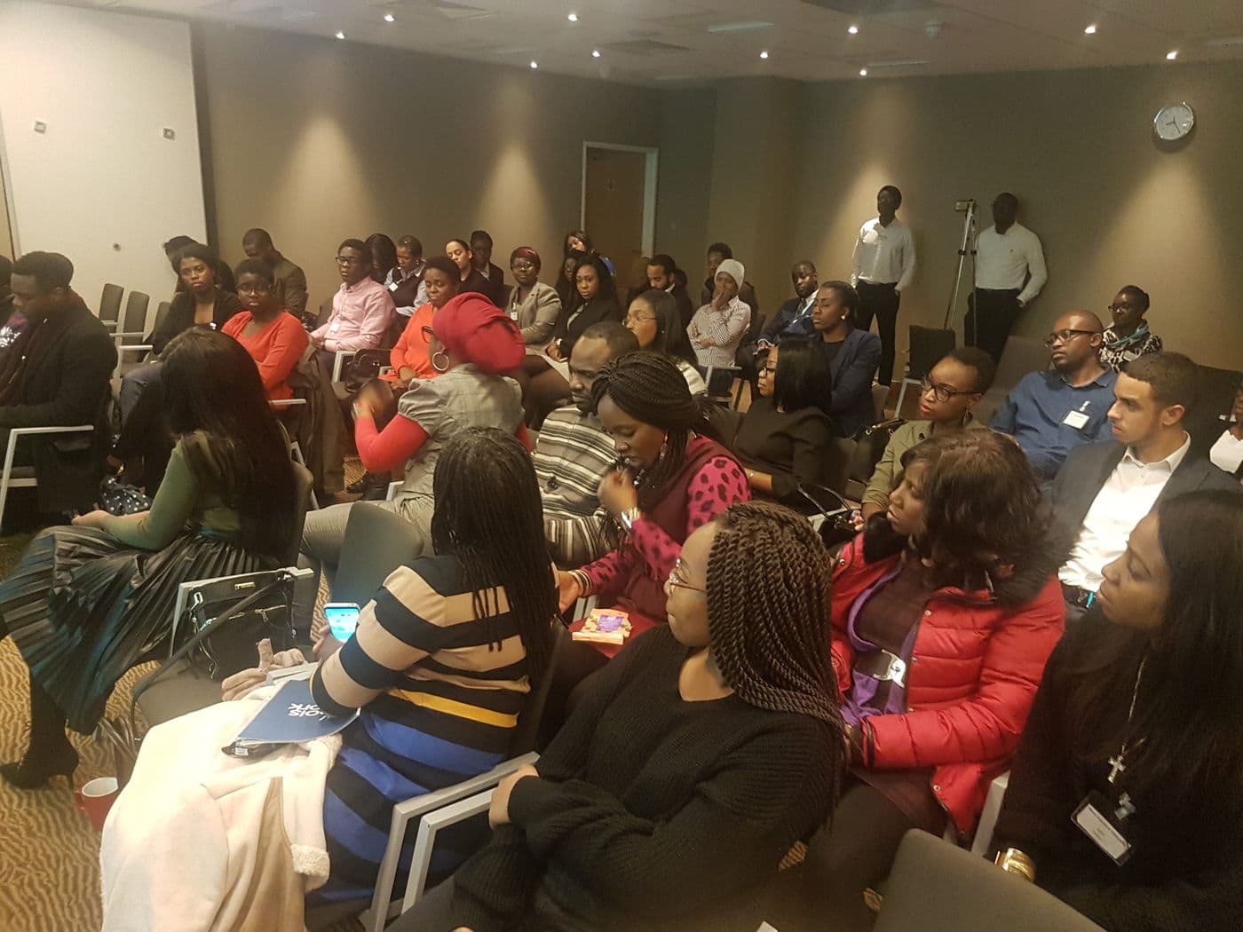 Attendees seated across the room