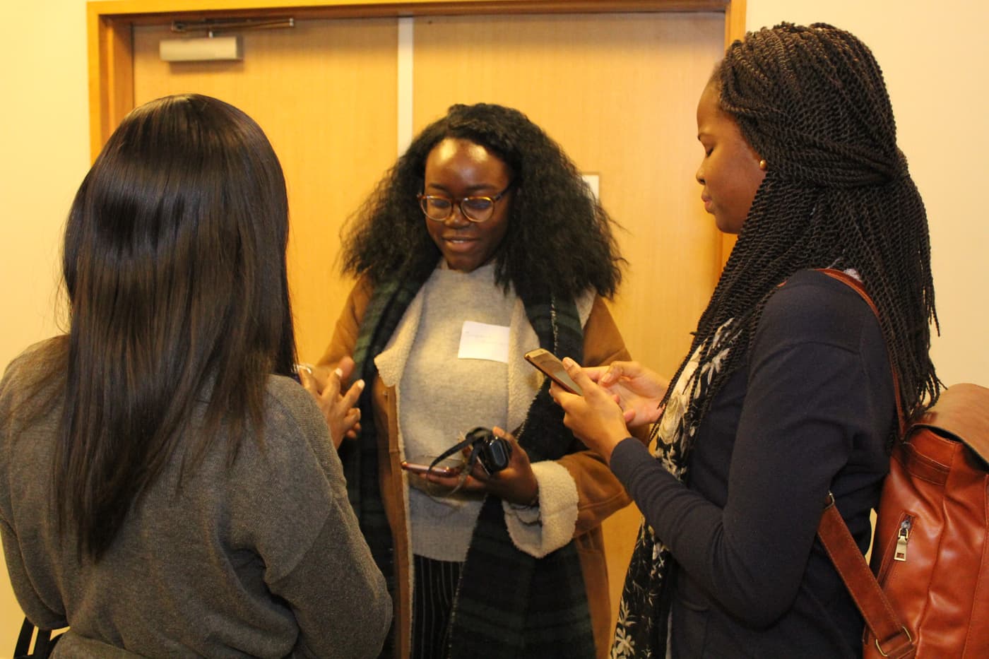 Two attendees swapping contact details