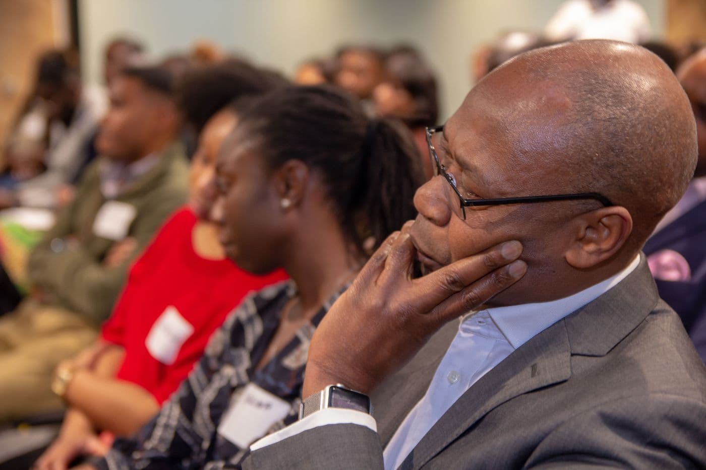 Attendees listening from the audience