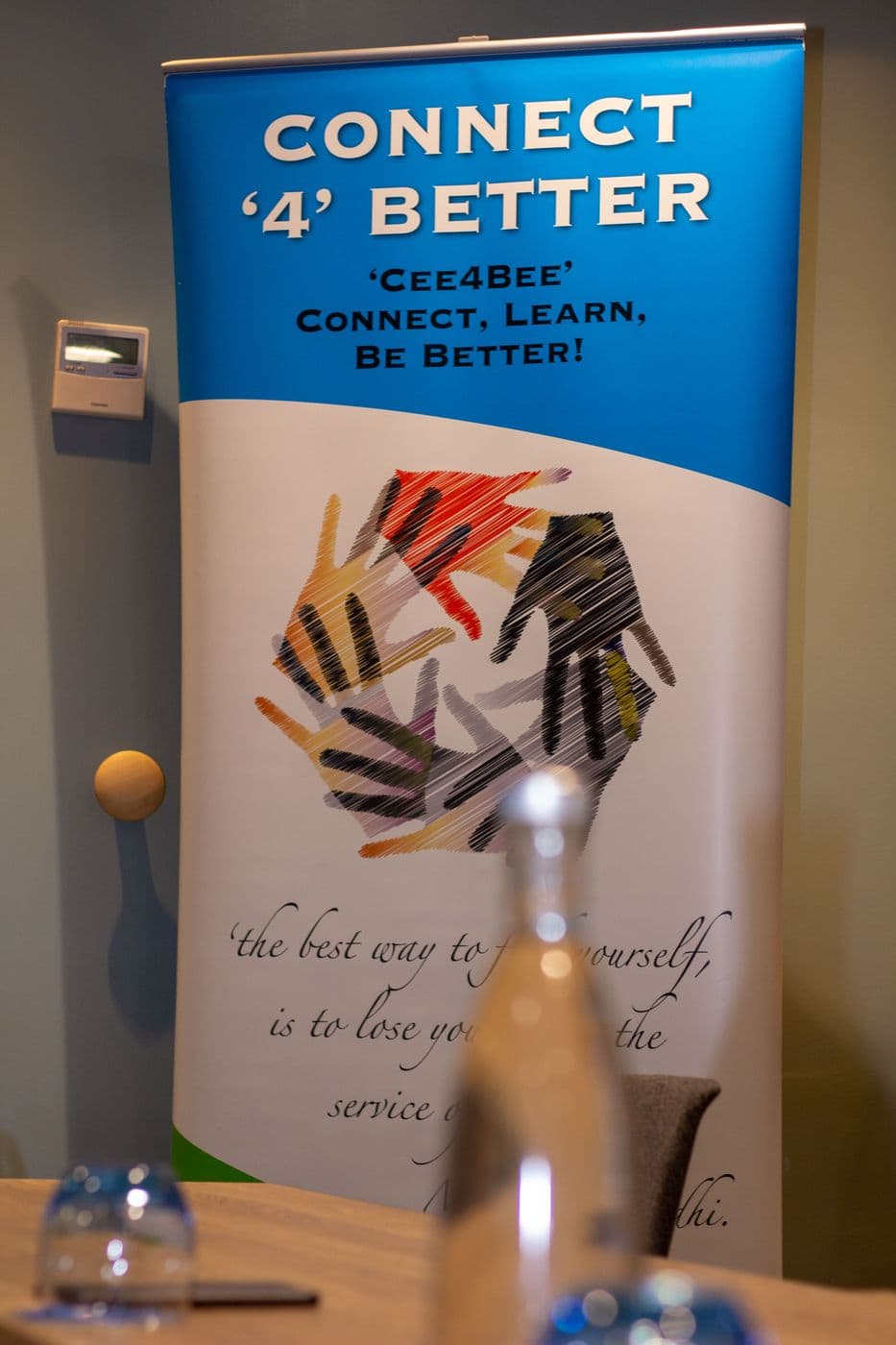 The Connect ’4’ Better banner beside the panel table