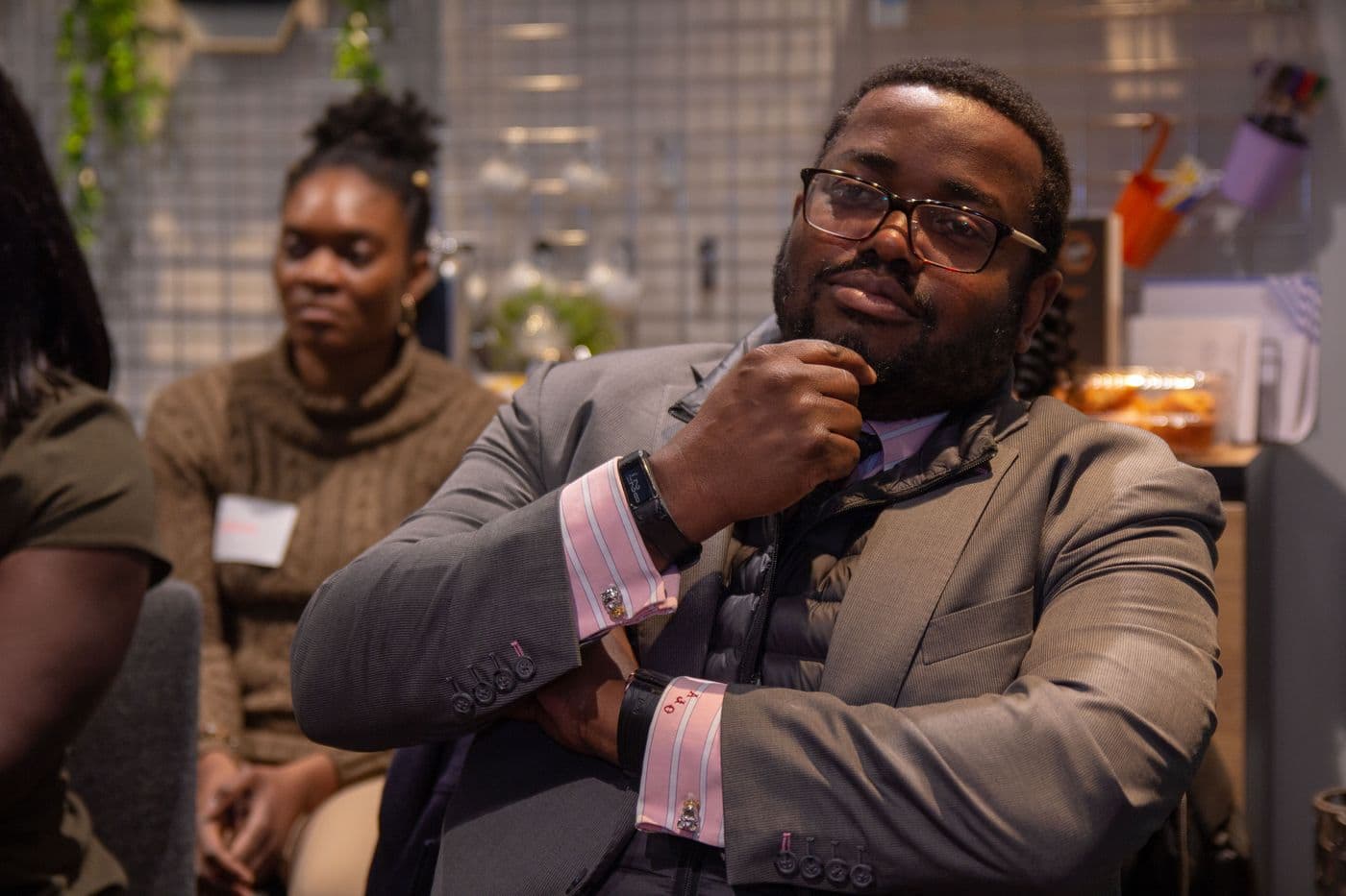 A speaker listening from the audience