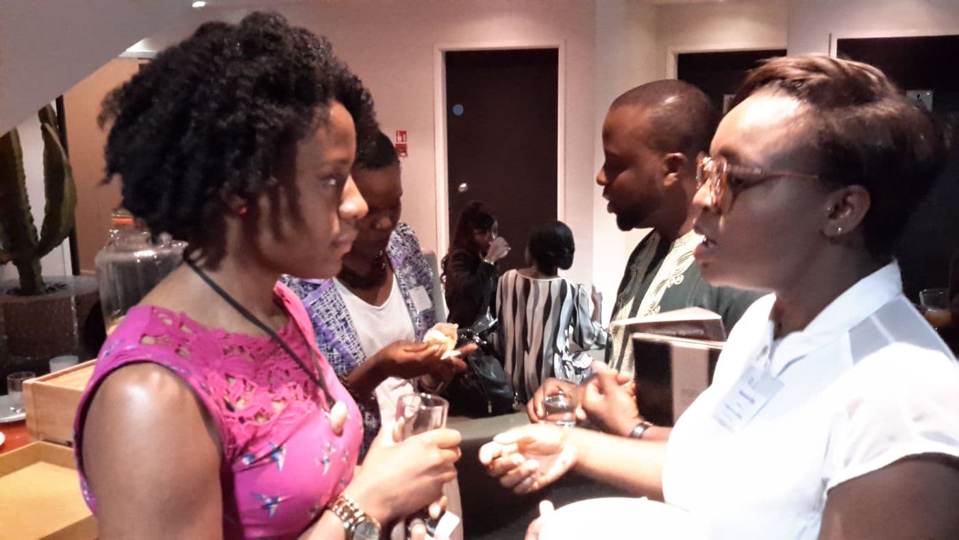 Two attendees in conversation