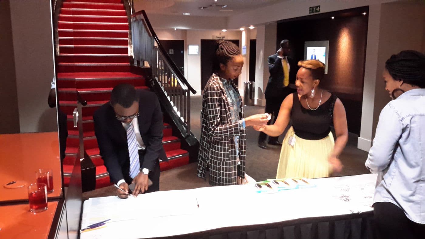 Attendees at the welcome desk