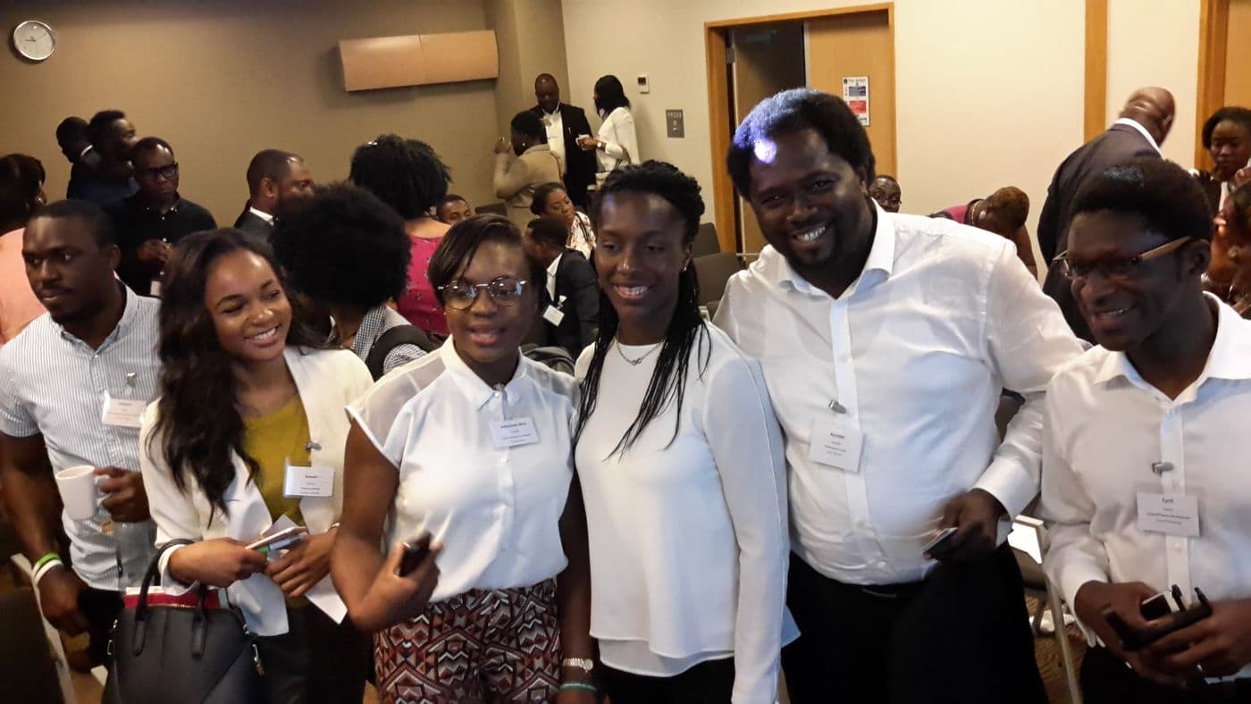 A group of attendees laughing together