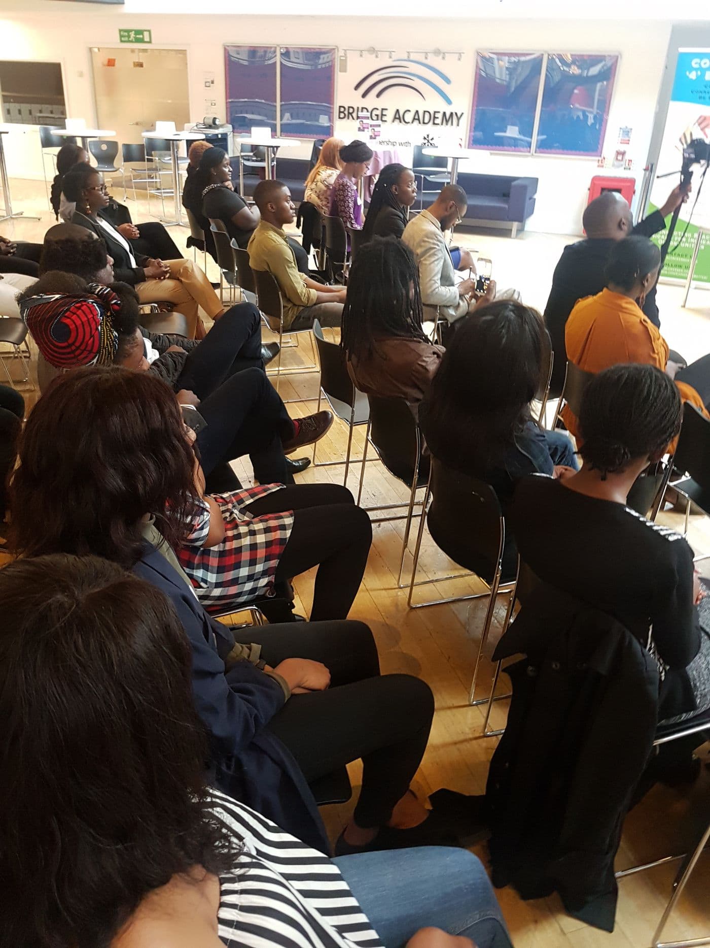 Young people seated in the audience