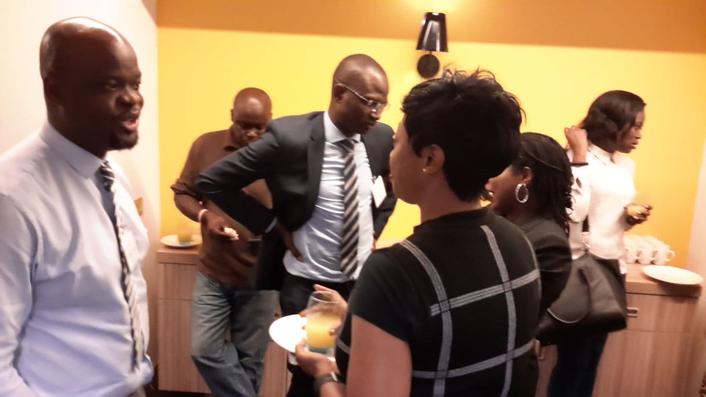 A group talking over refreshments