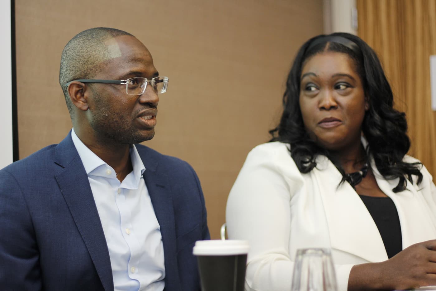 Two panellists listening to a question