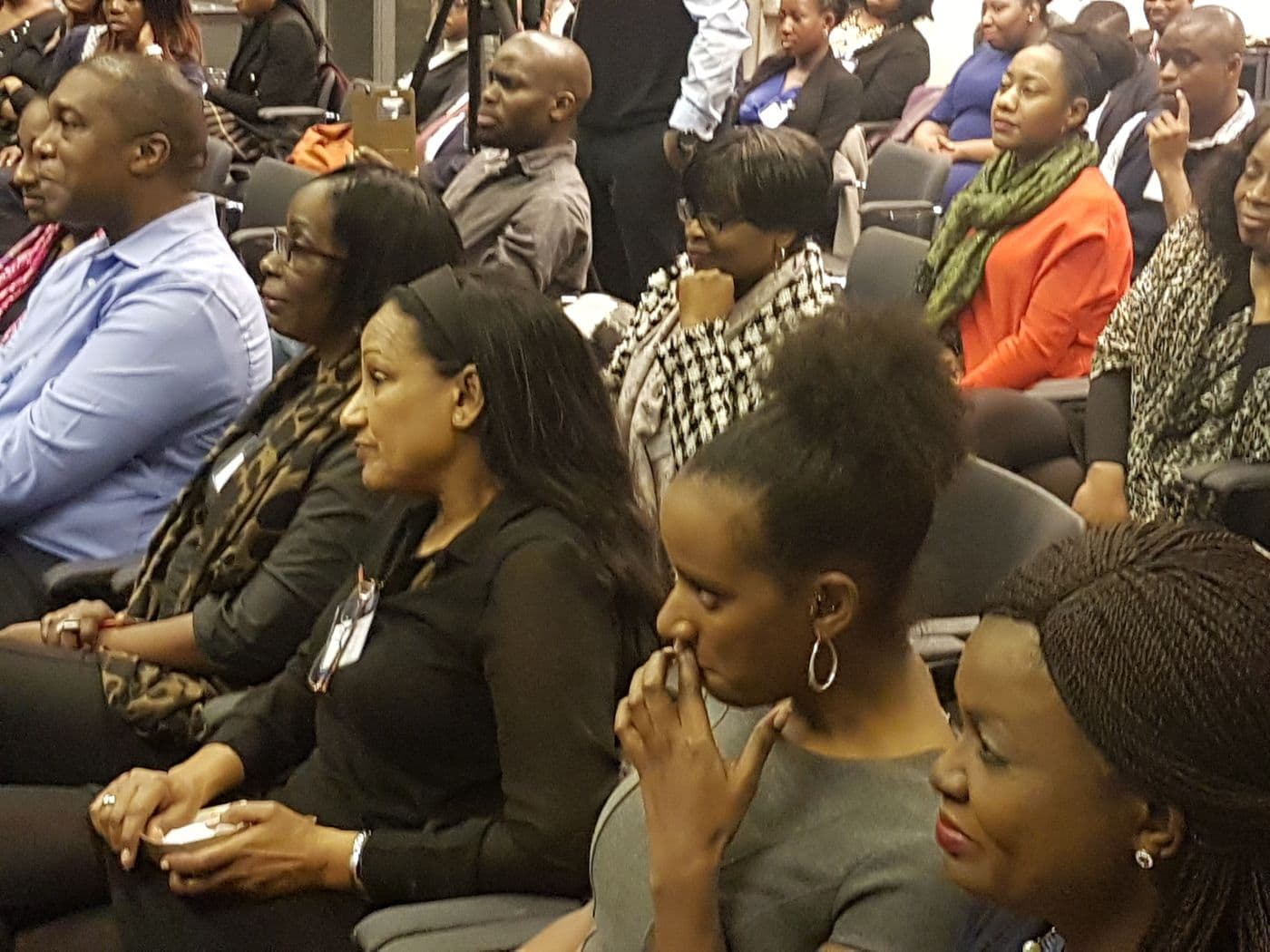 Attendees listening from the front rows