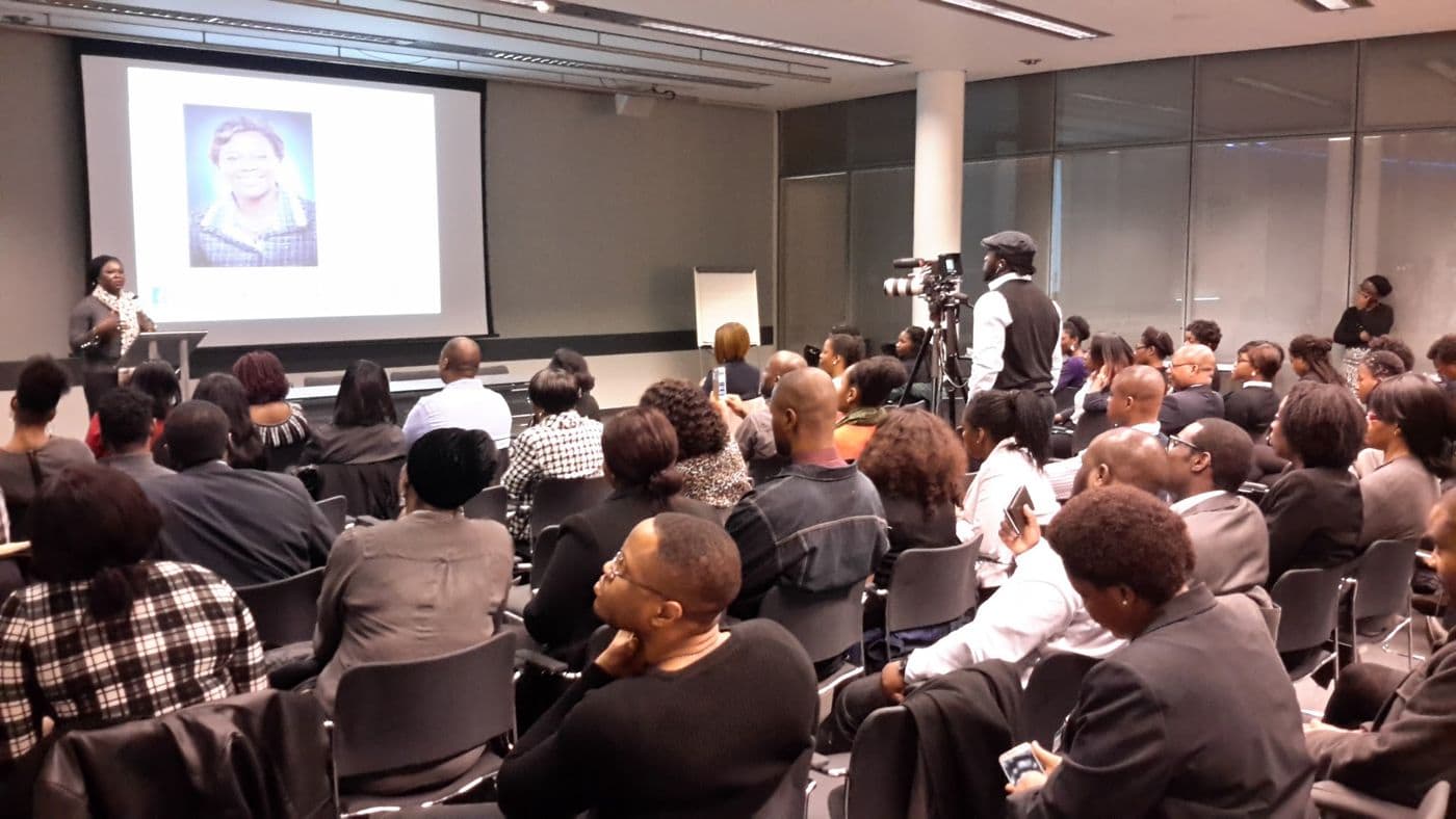 The lecture theatre seen from the back during a presentation
