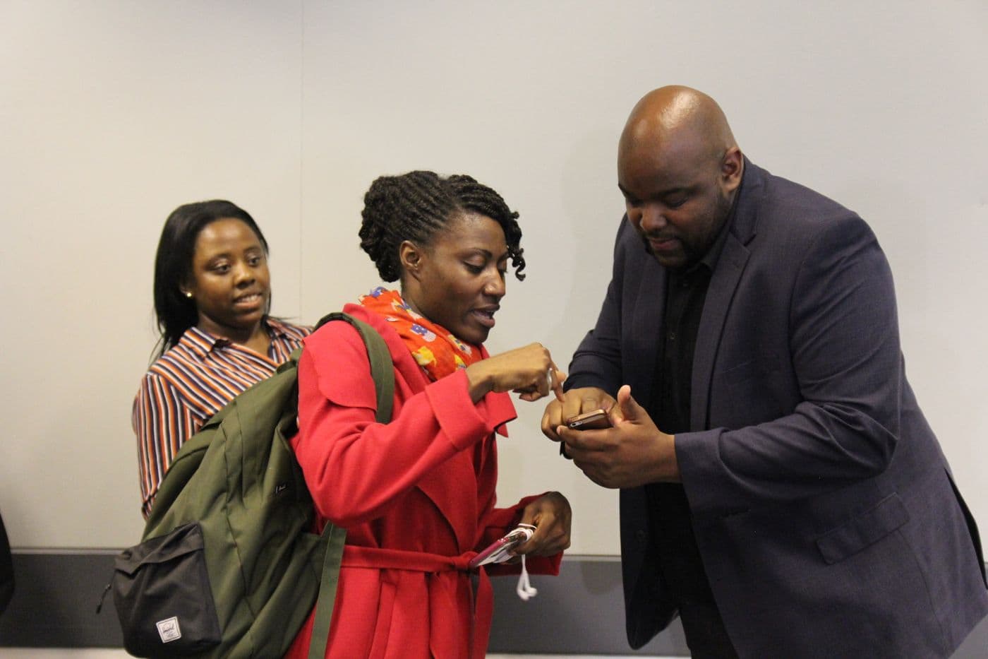 Two attendees greeting each other after the panel