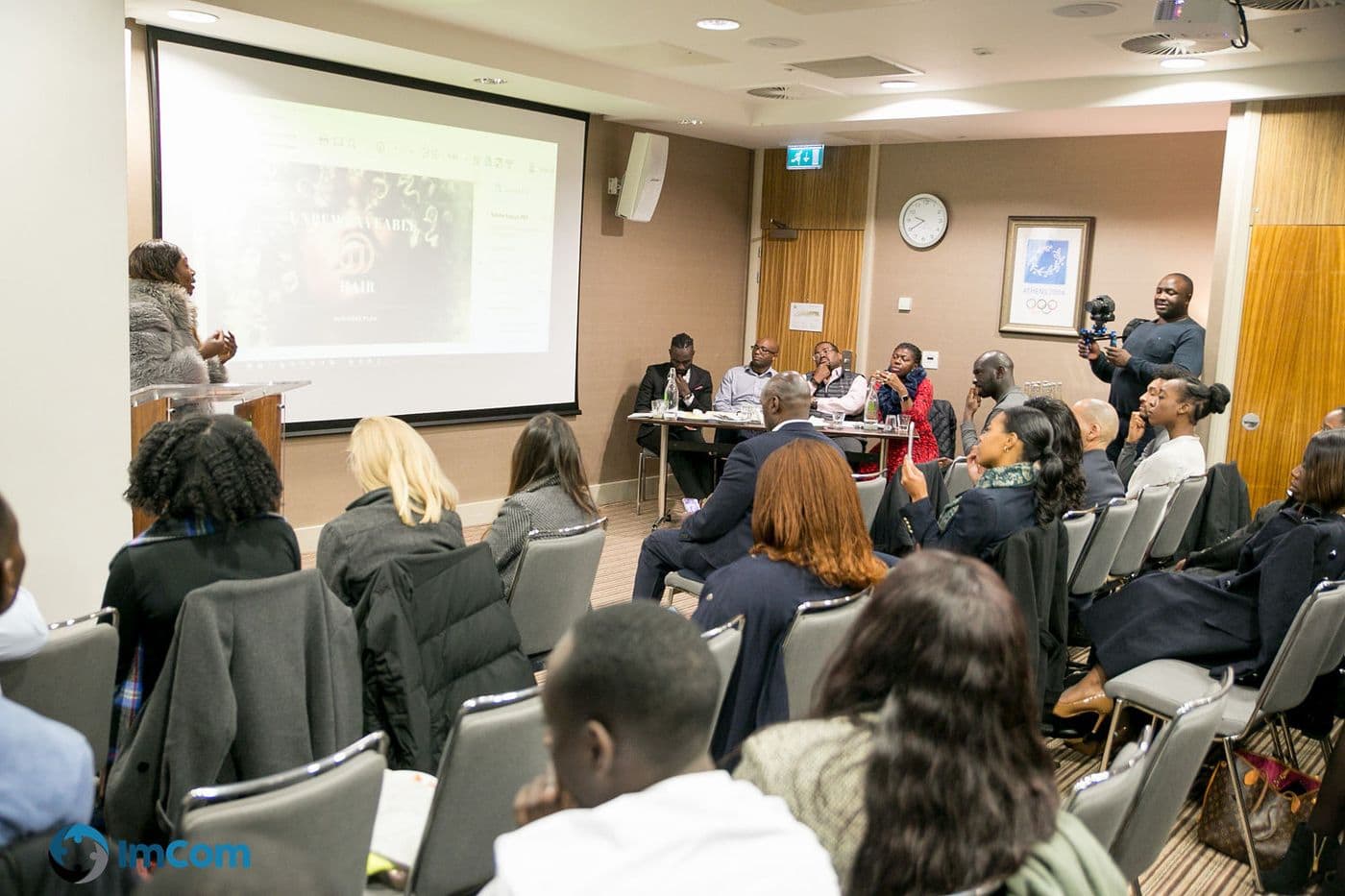 The room seen from the back as a presentation runs