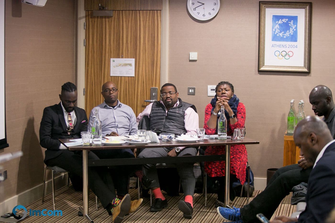 The panel seated behind the table