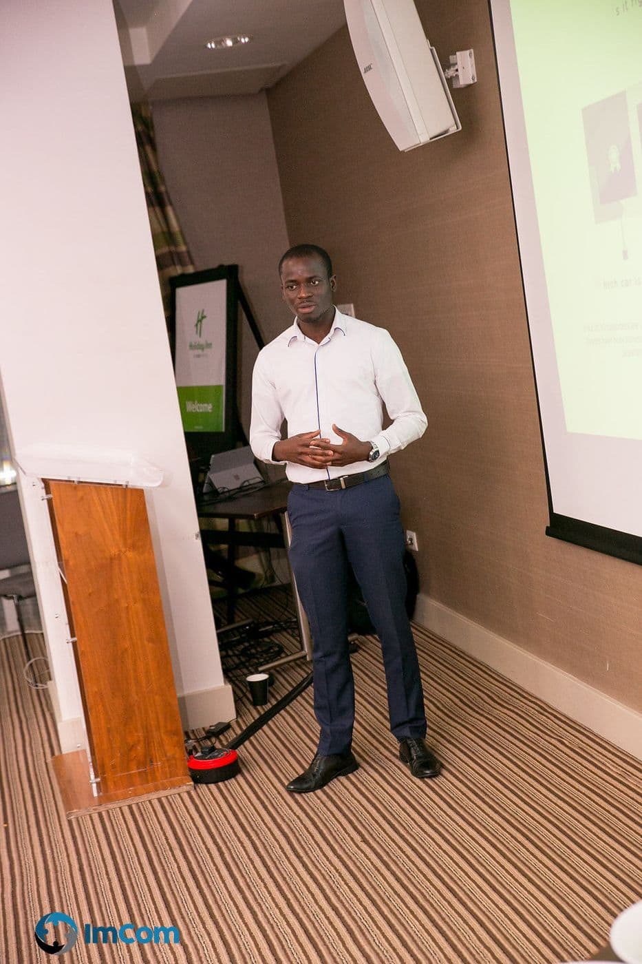 A speaker standing to present to the room