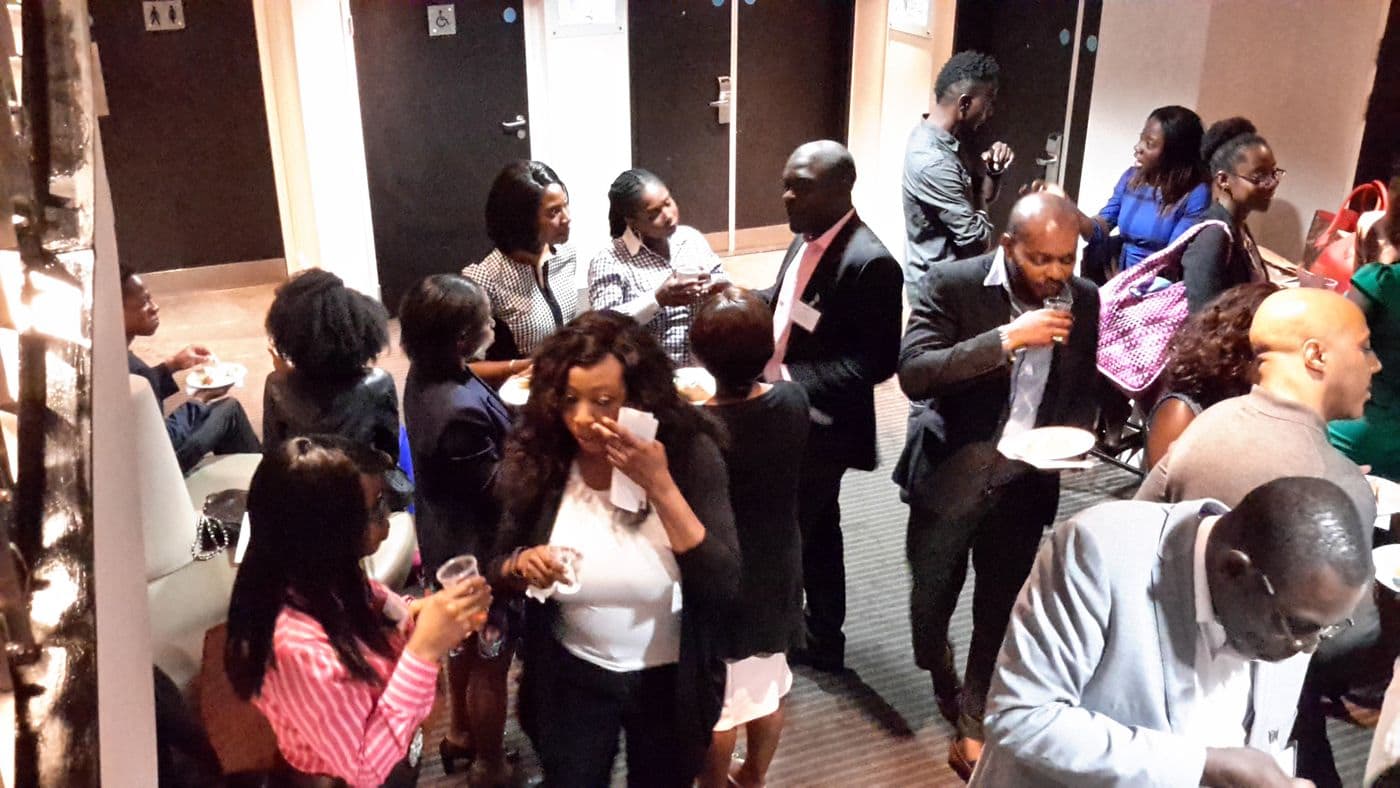 Attendees talking over refreshments