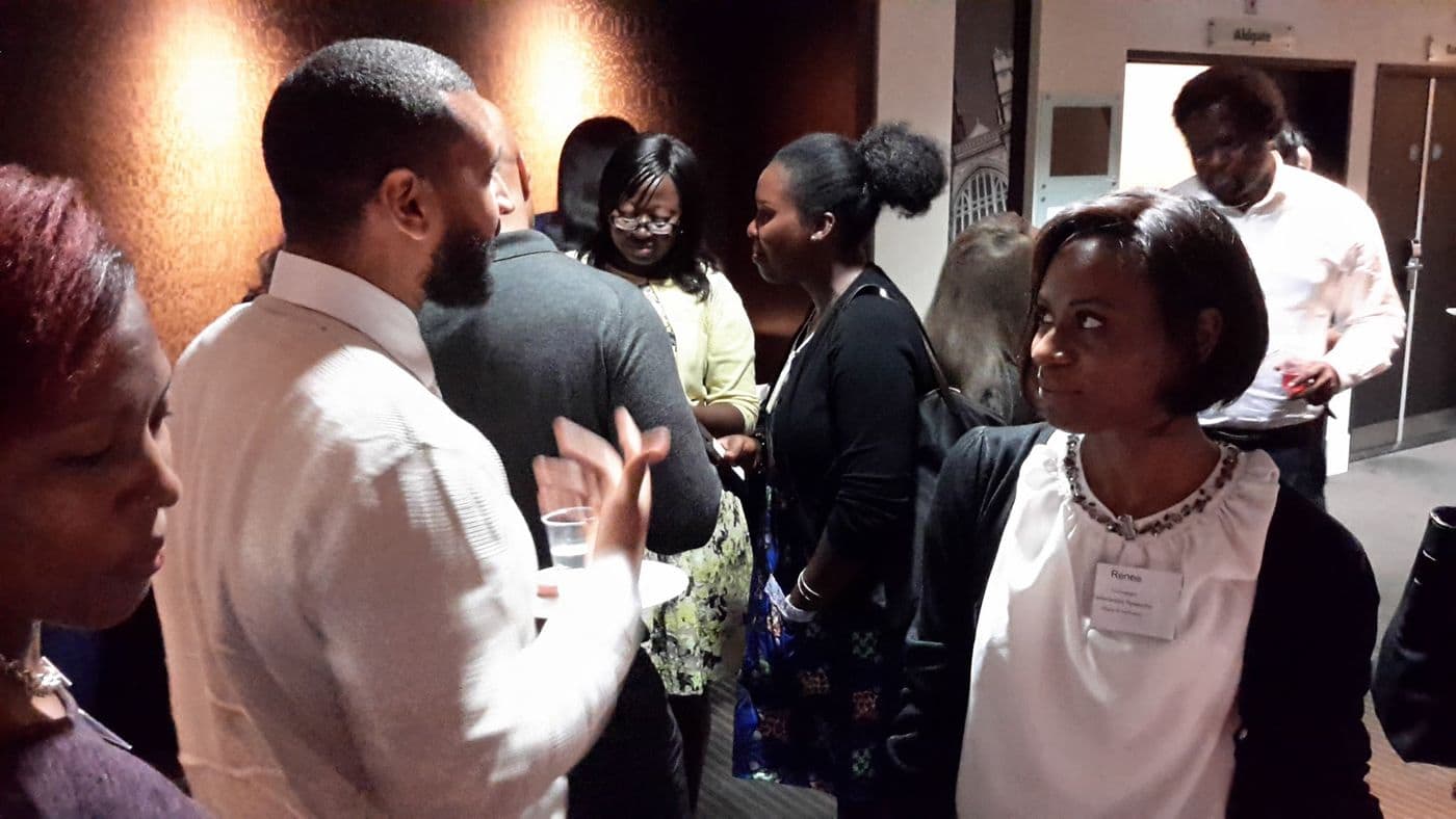 A group of attendees talking together