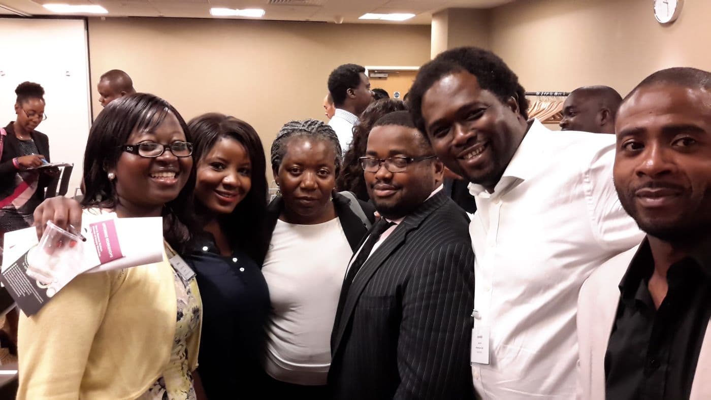 Five attendees together for a photograph