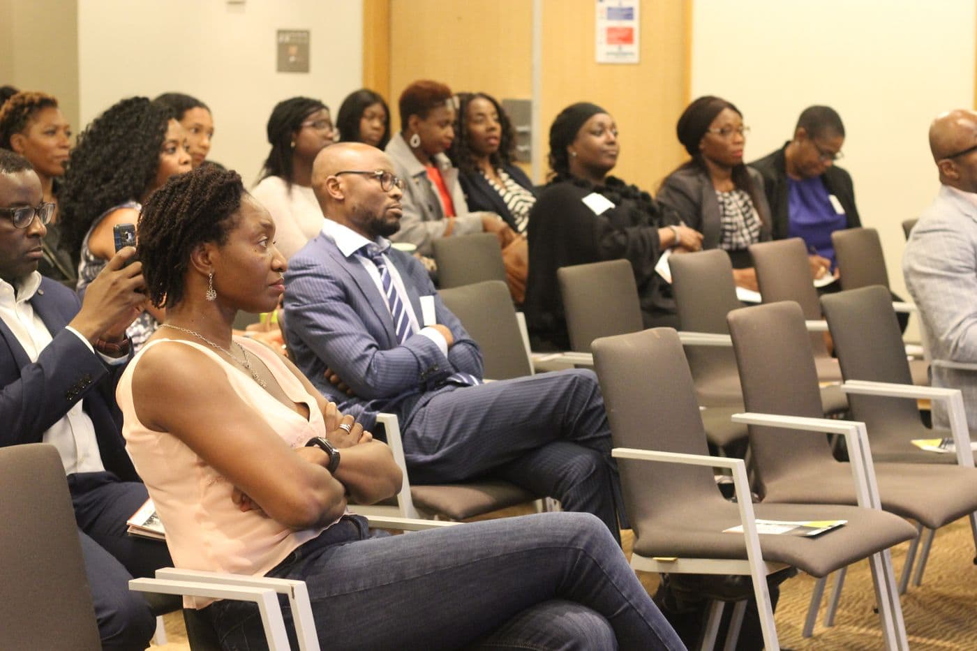 The audience seated across several rows