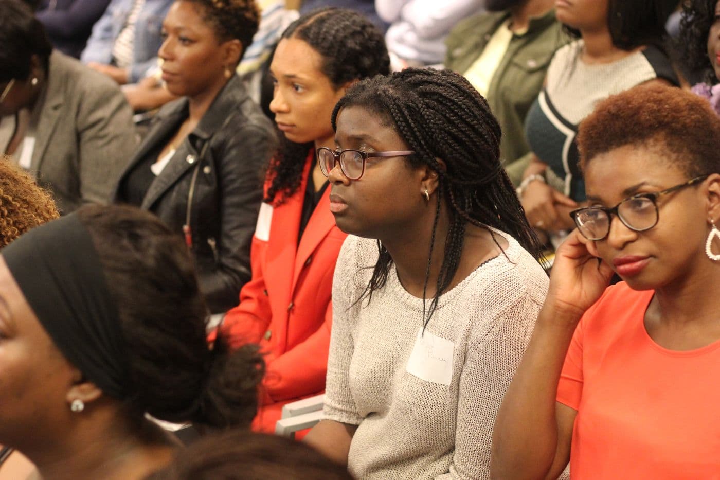 Attendees listening from the front row