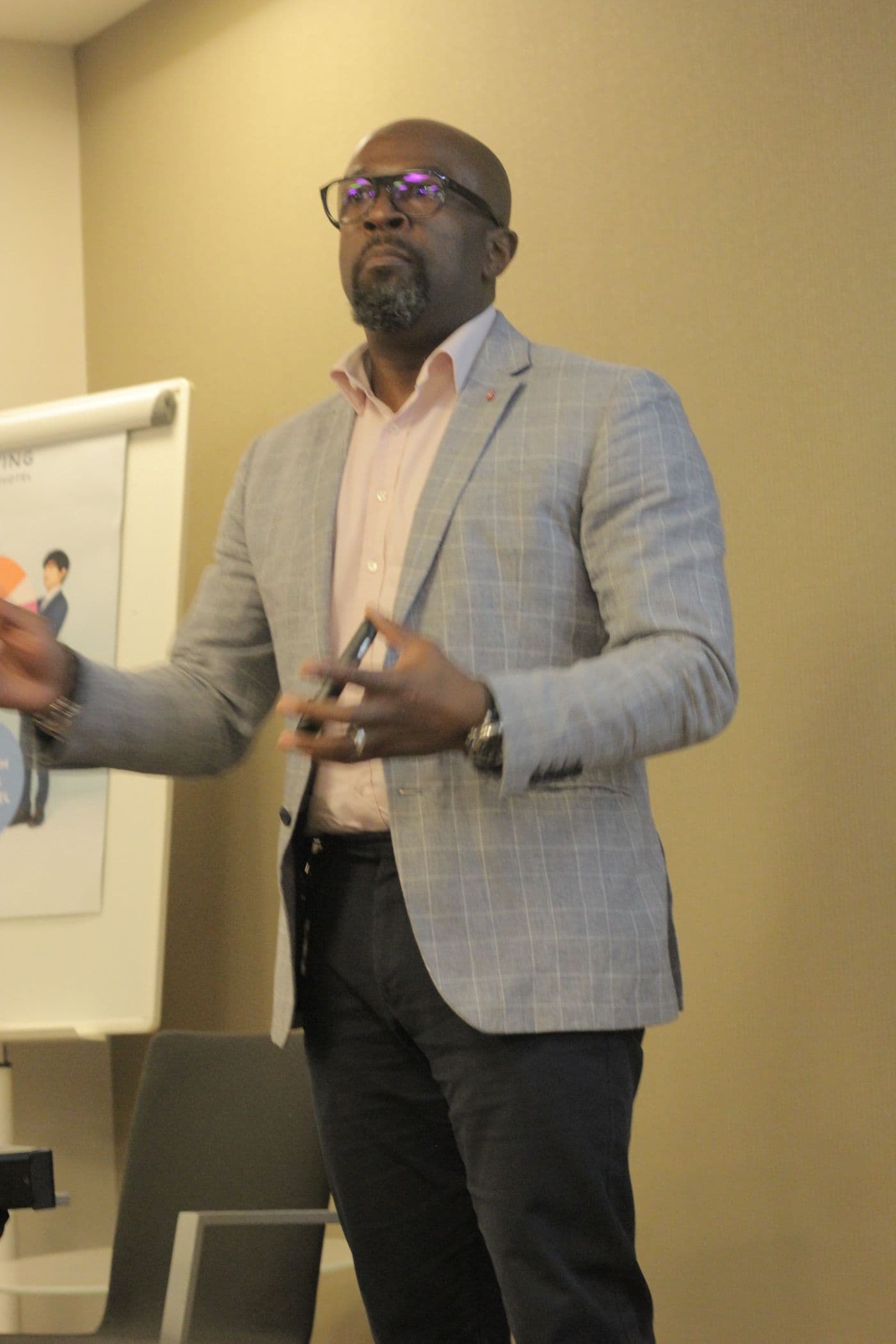 A speaker presenting to the room