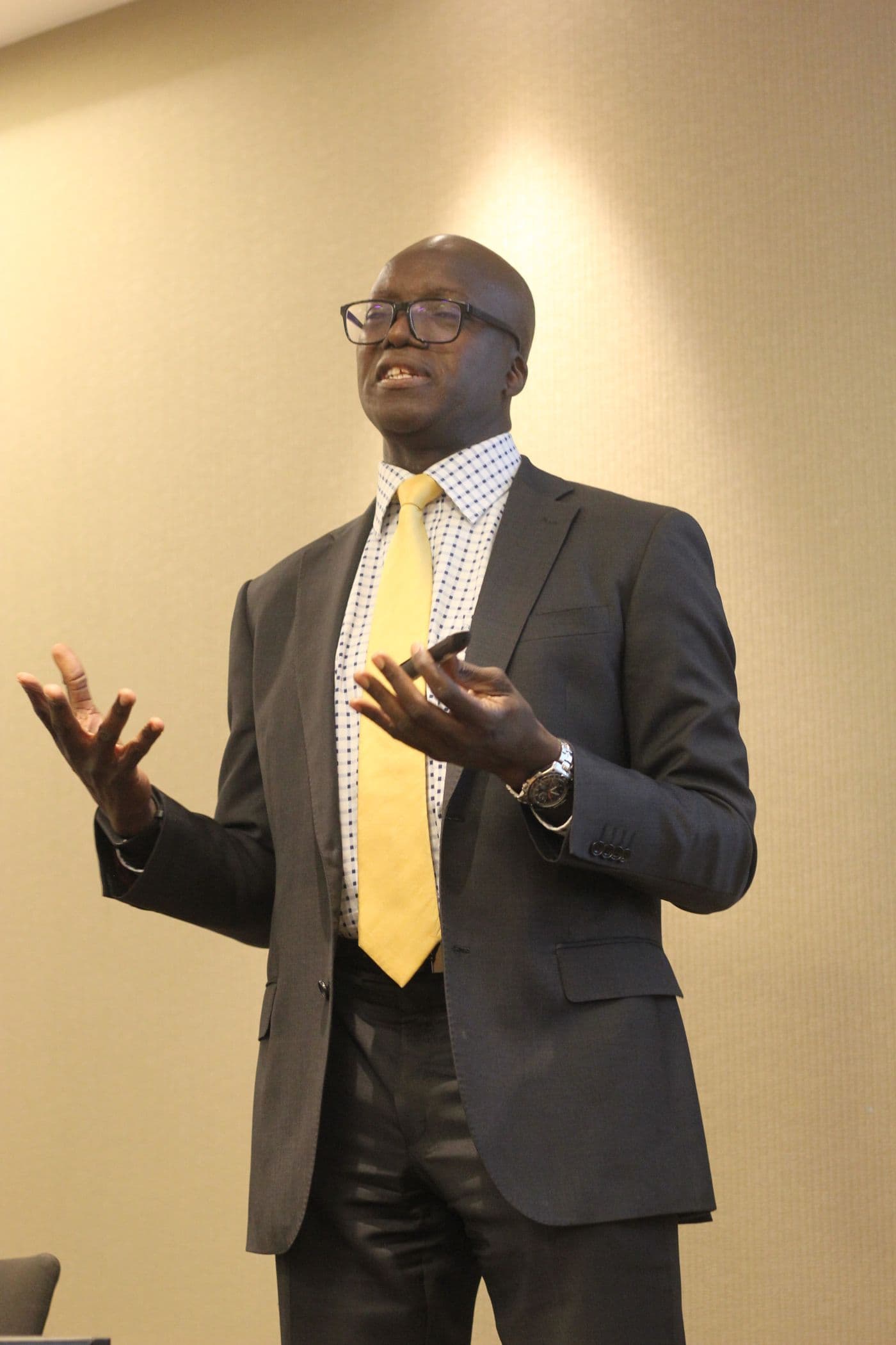 A speaker making a point to the room