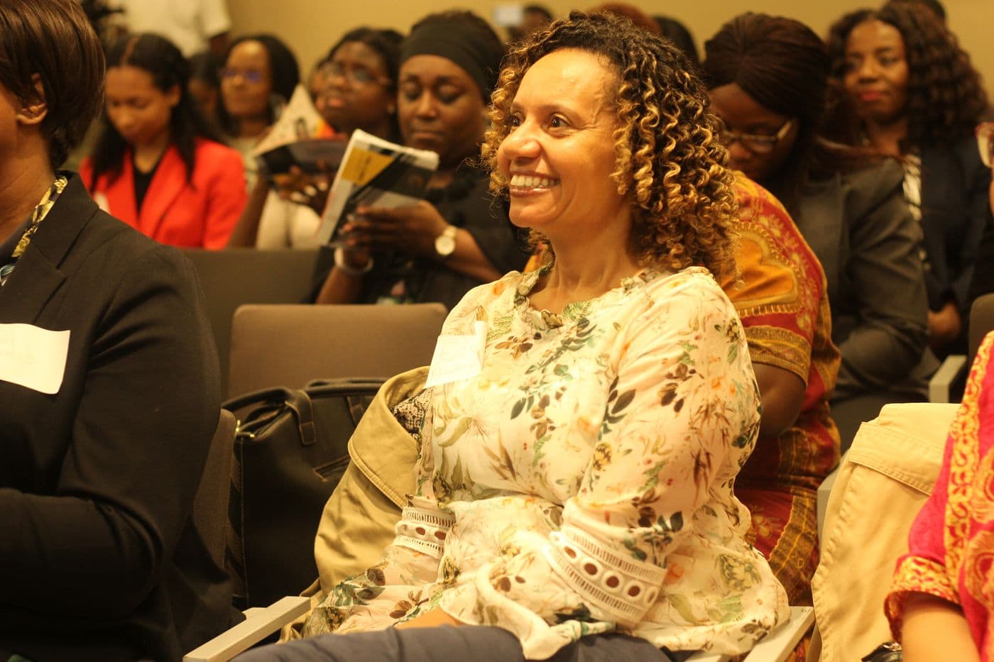 An attendee smiling during the discussion